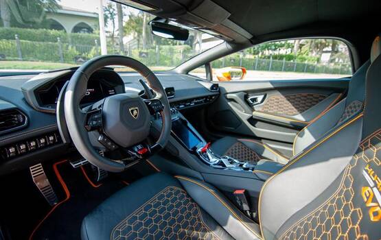 Lamborghini Huracán EVO Spyder orange rental in Dubai - CarHire24